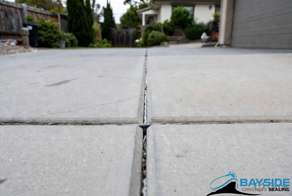Flexible caulking applied to concrete cracks before sealing