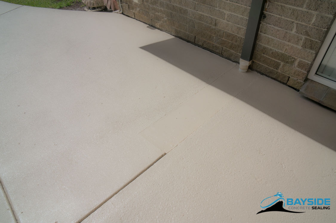 Detail of pitted exposed aggregate surface after professional restoration