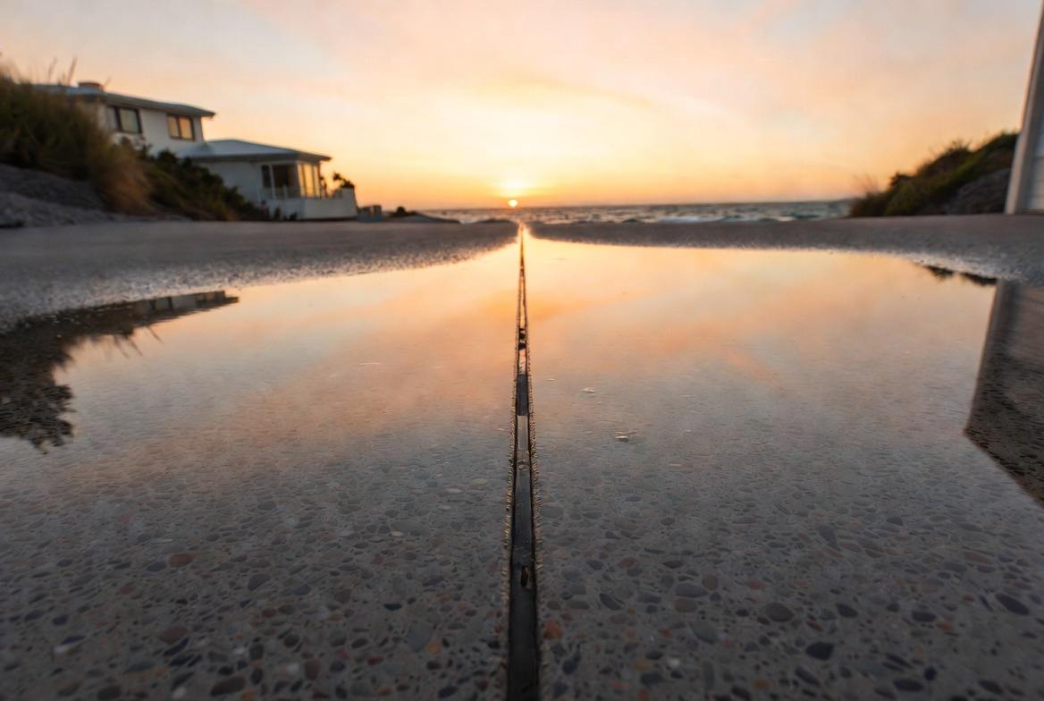 Expansion joint and surface prep detail at sunset on Melbourne concrete